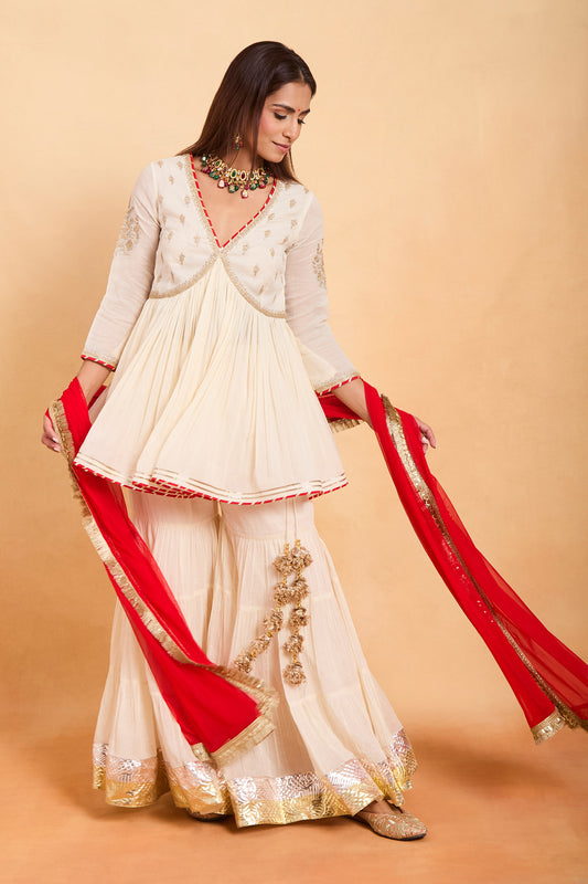 Chic Cream Peplum Kurti & Gharara Set with Vibrant Red Contrast