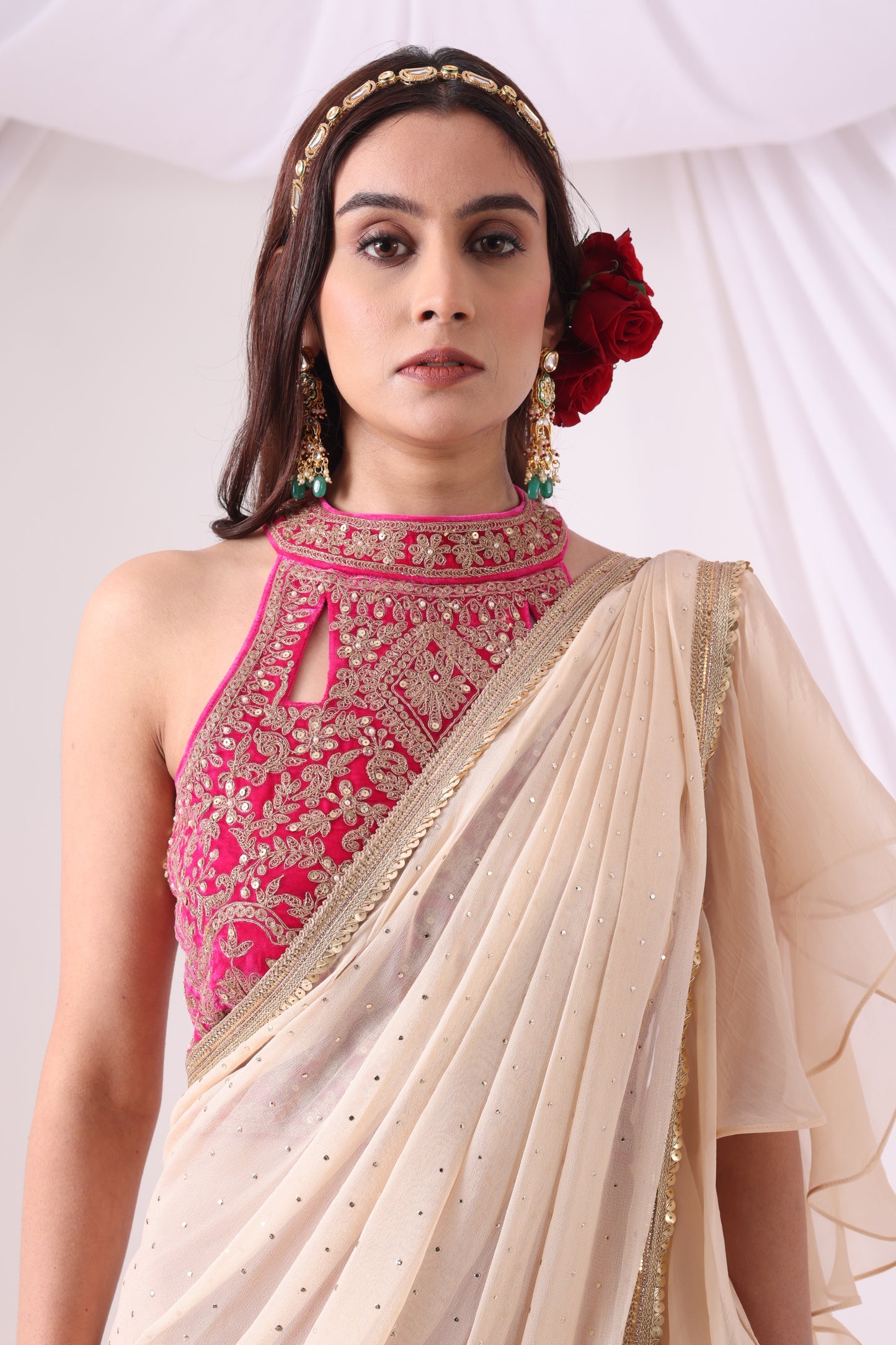 Beige Draped Saree with Magenta Halter Blouse
