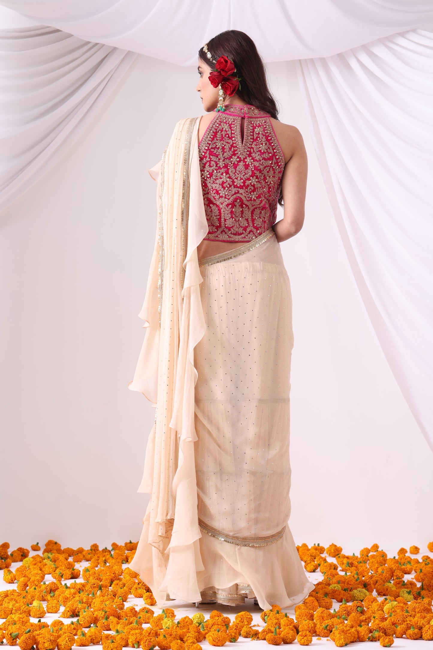 Beige Draped Saree with Magenta Halter Blouse
